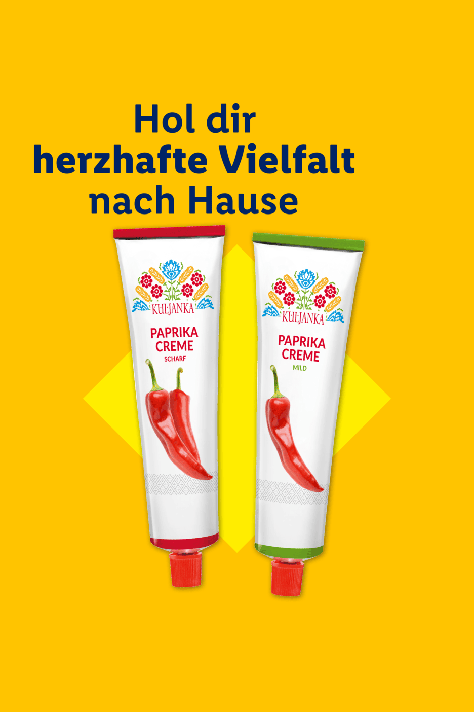Zwei Tuben Paprikacreme in den Sorten scharf und mild auf gelbem Hintergrund.